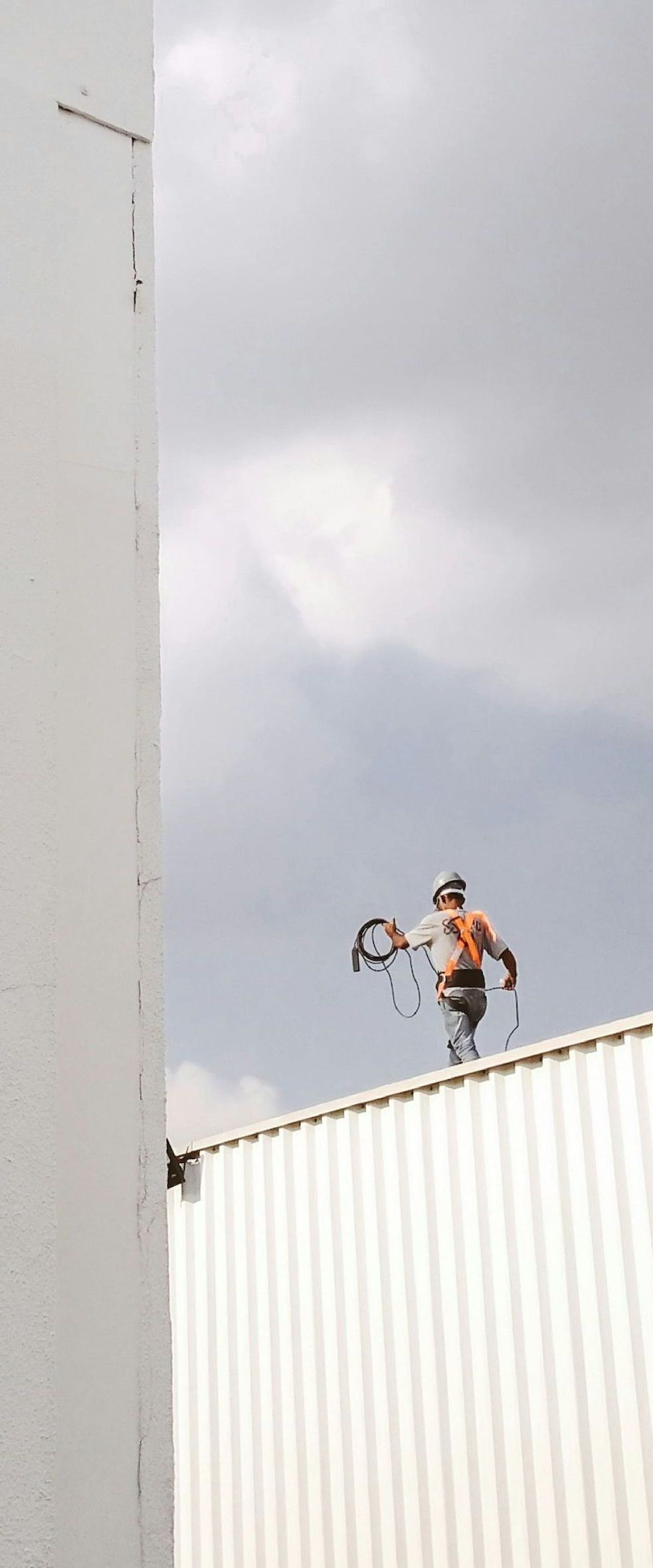 worker walking on roof