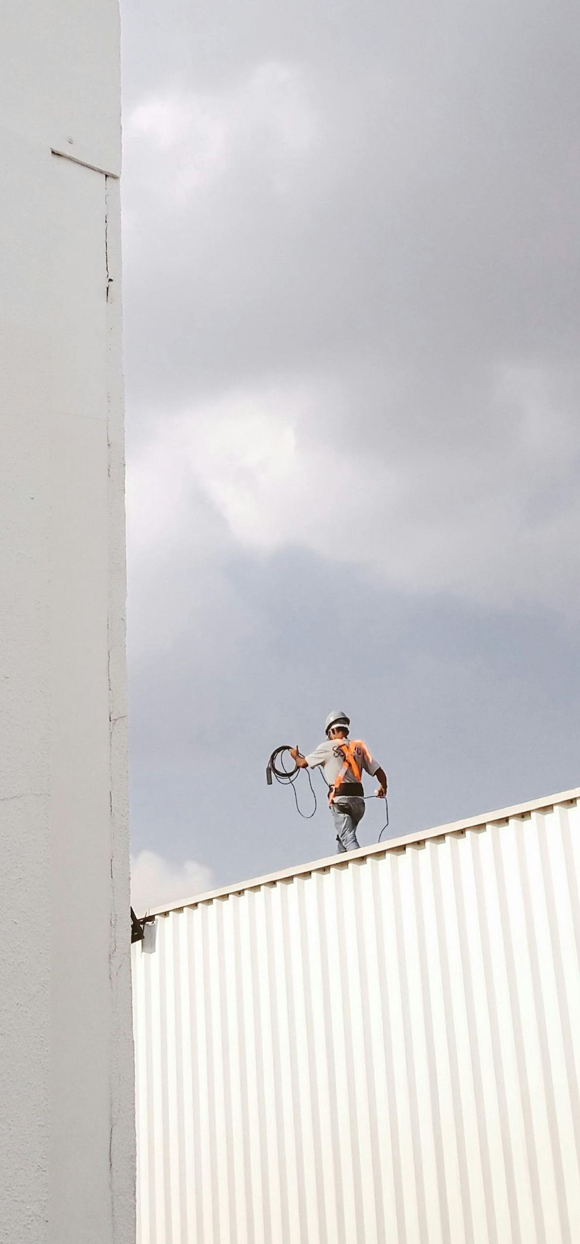 man walking on a roof