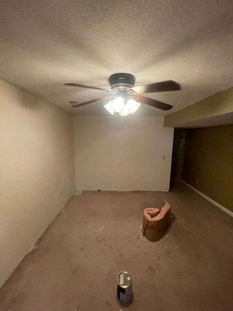 Bedroom before water damage mitigation showing affected carpet