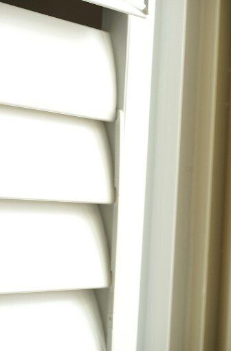 Close up view of closed white Plantation Shutters.