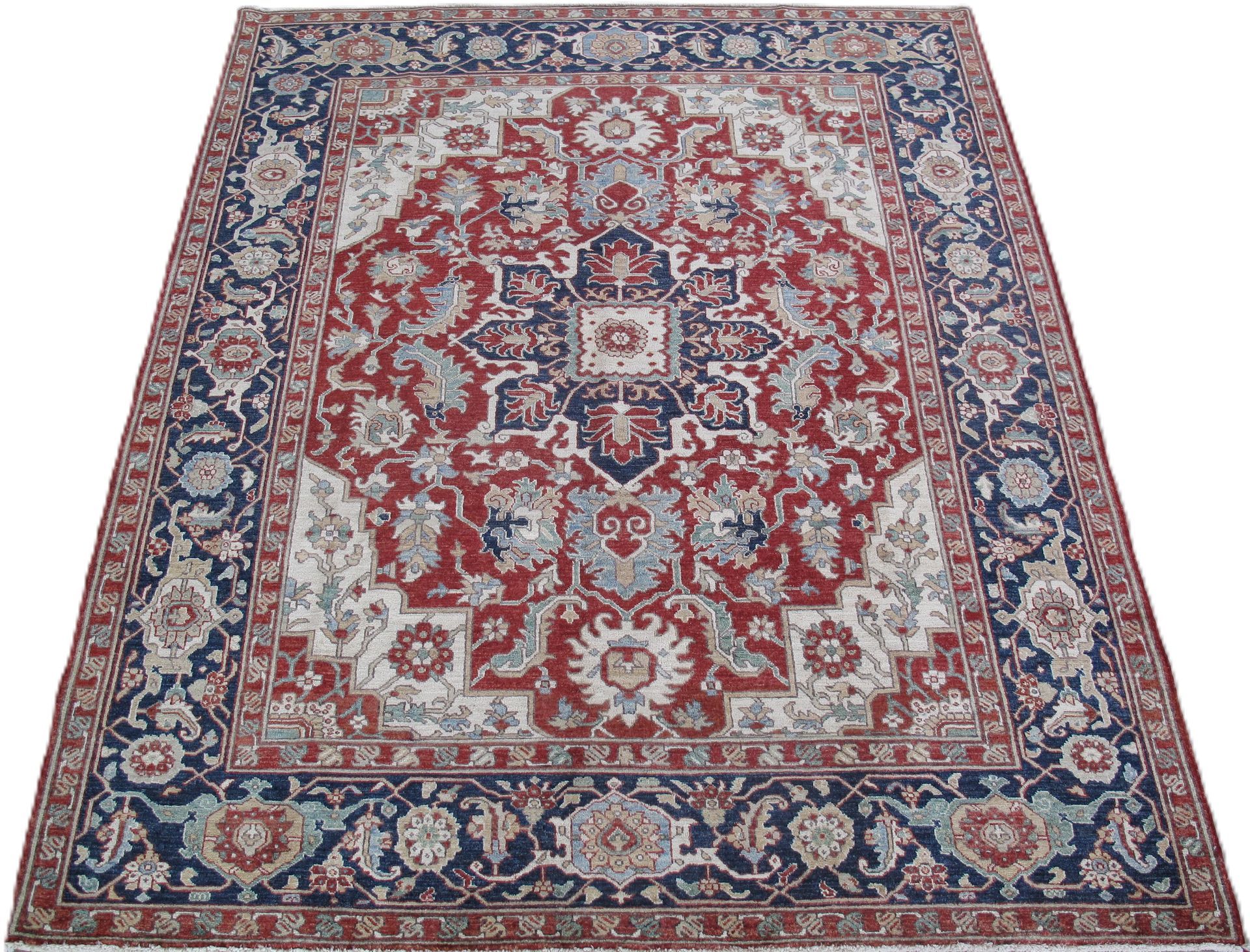Red and blue Oriental rug with intricate floral patterns and a dark blue border.