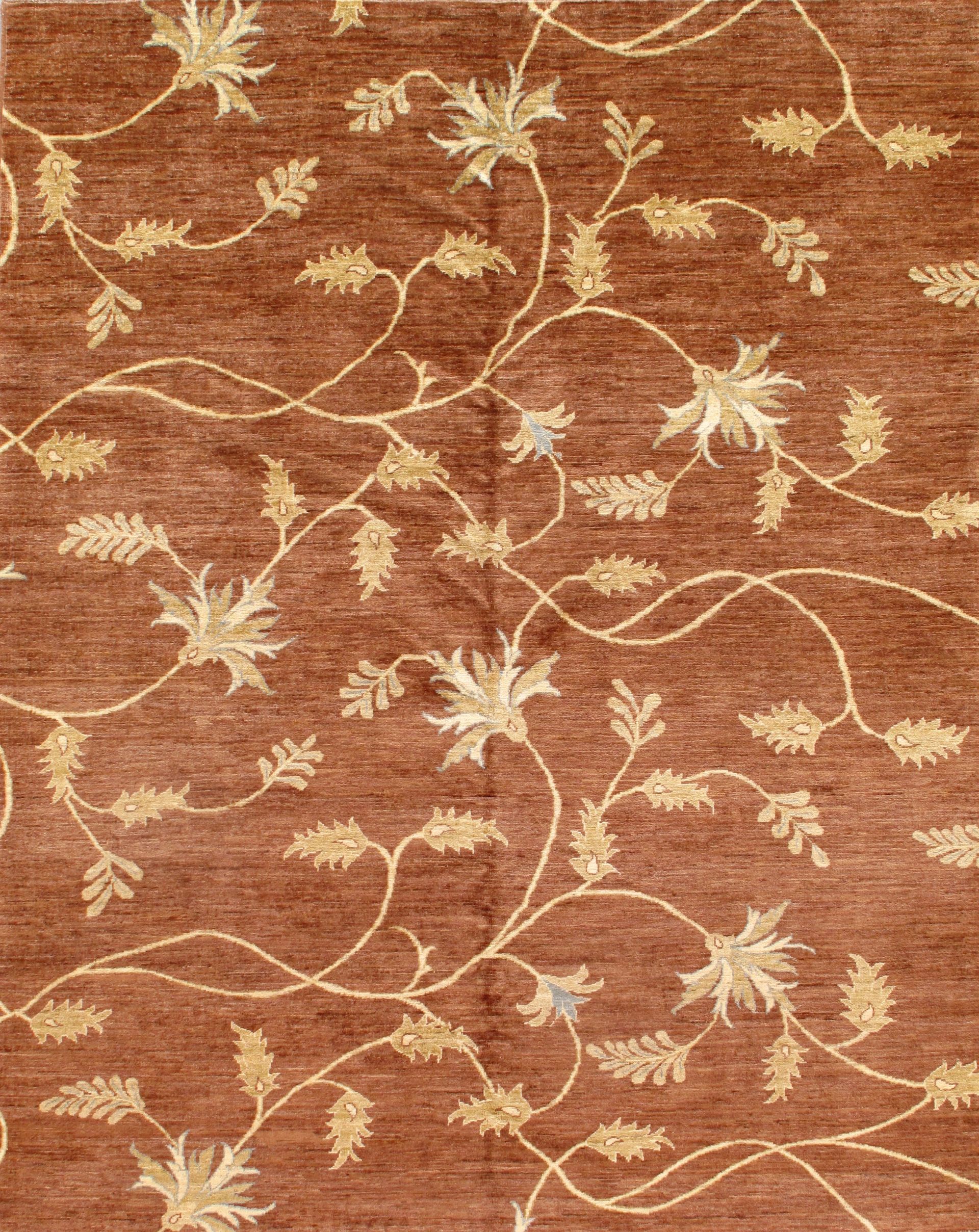 Brown rug with gold floral vine pattern.