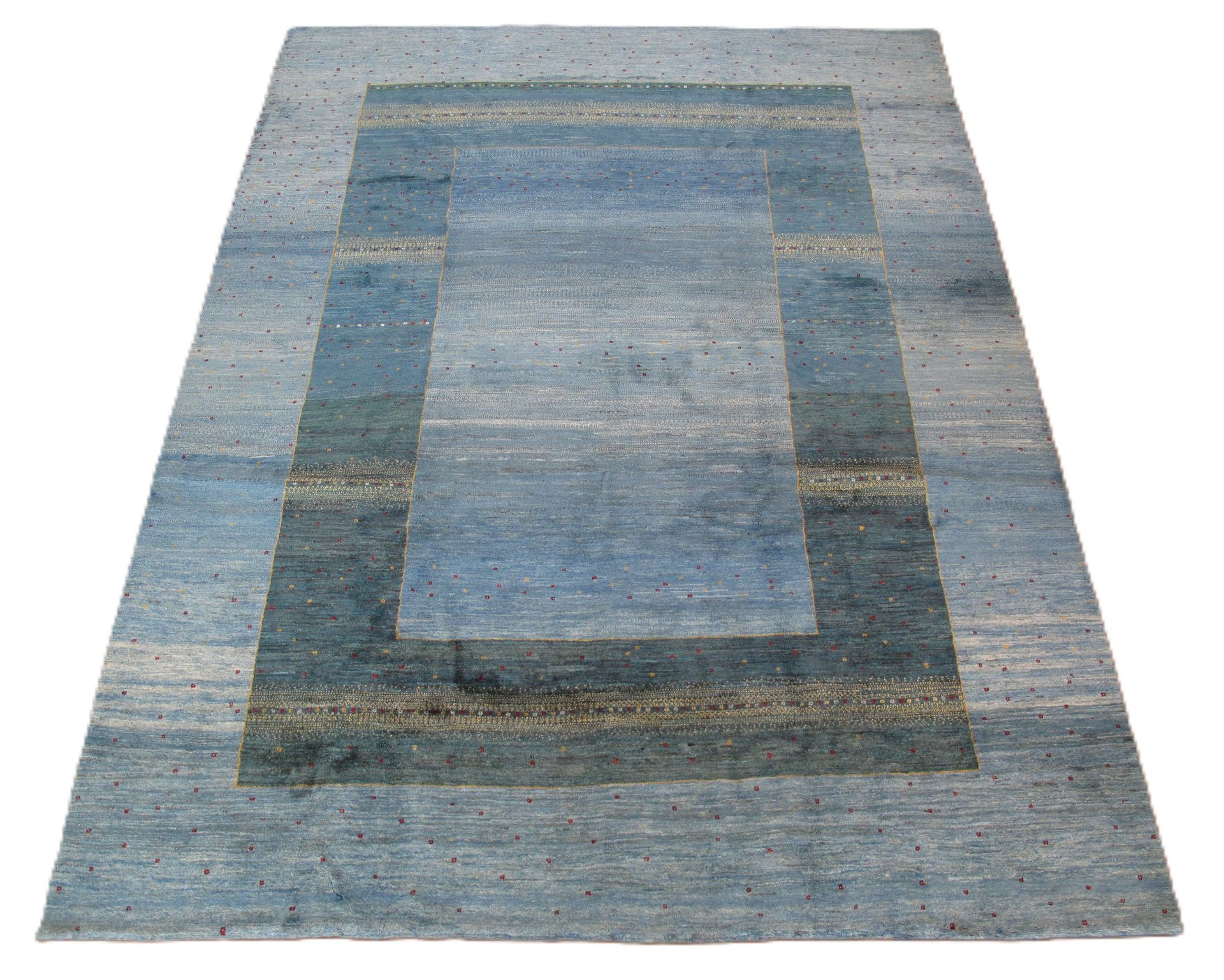 Blue and gray rectangular rug with a darker border and lighter center.
