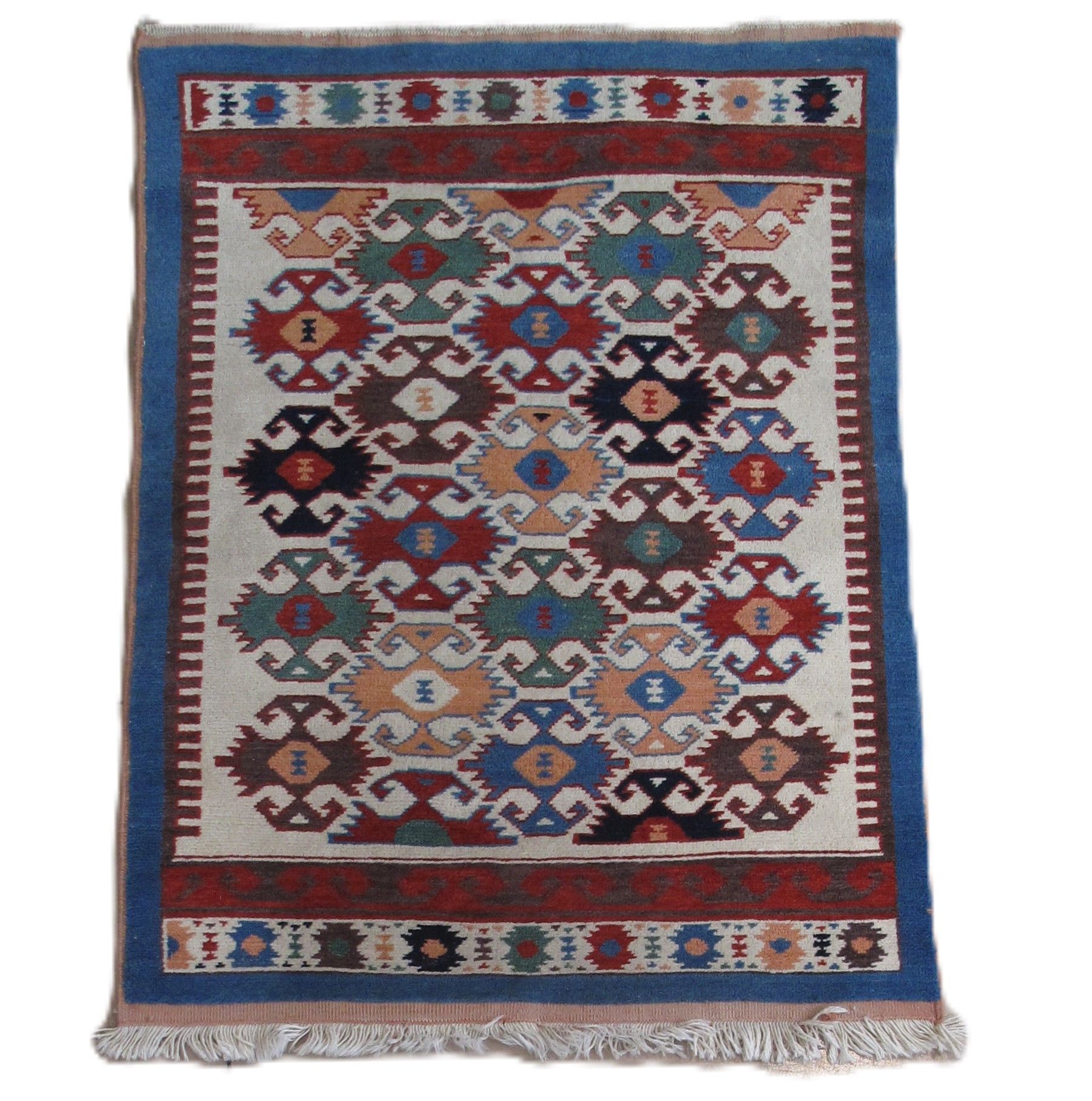 Colorful patterned rug with blue, red, and beige geometric designs.