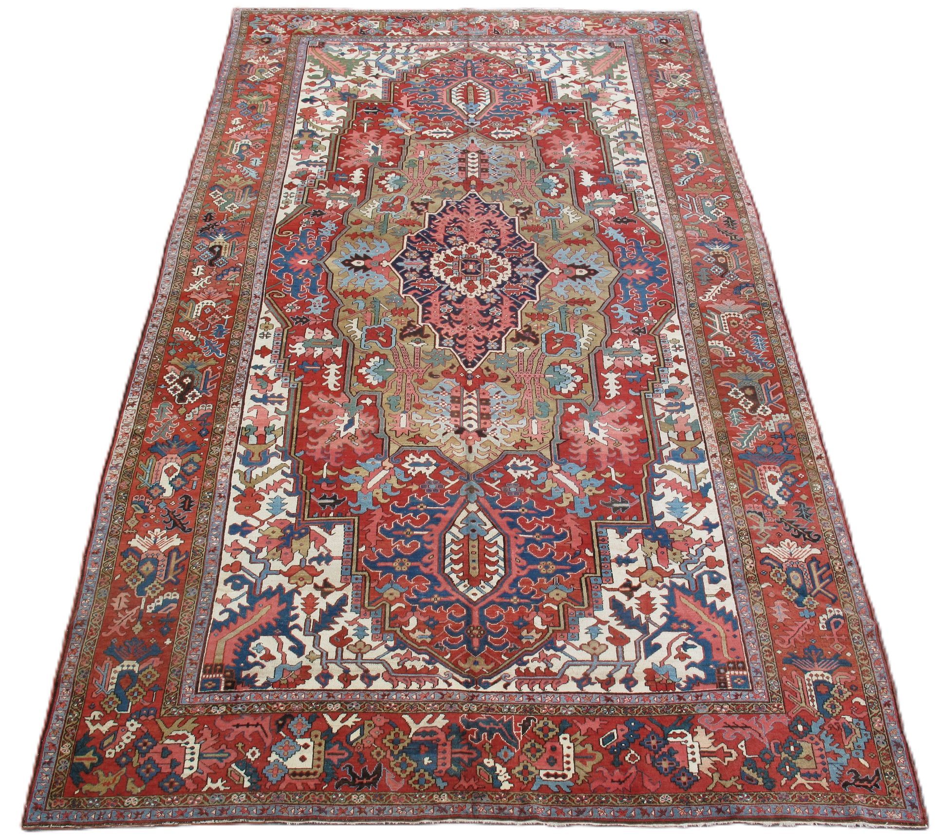 Ornate red and blue Persian-style rug with intricate floral and geometric patterns