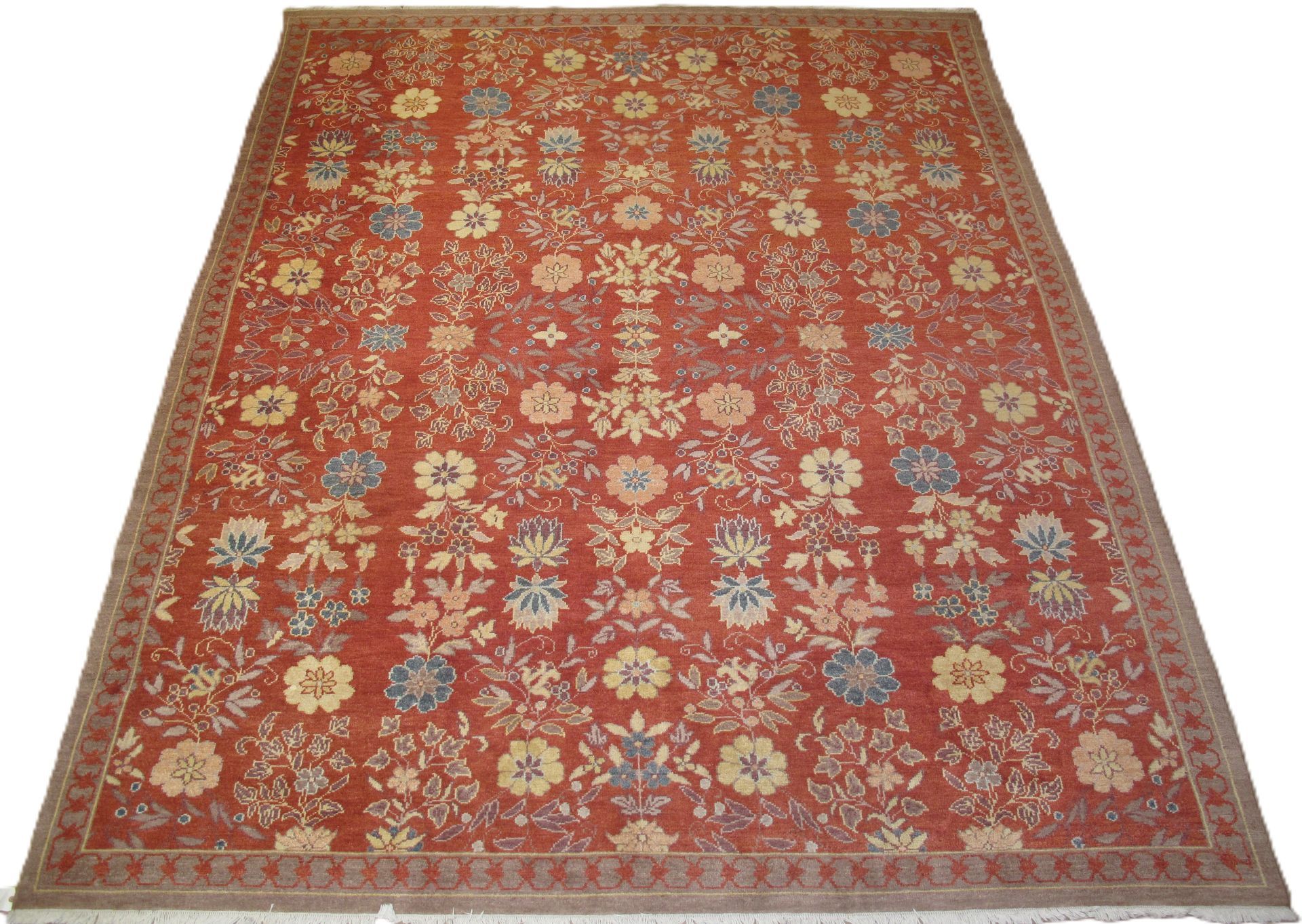 Red and gold oriental rug with floral pattern.