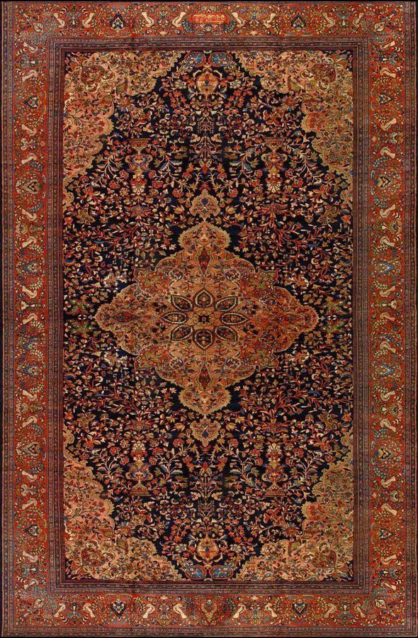 A close up of a rug with a floral pattern on it.