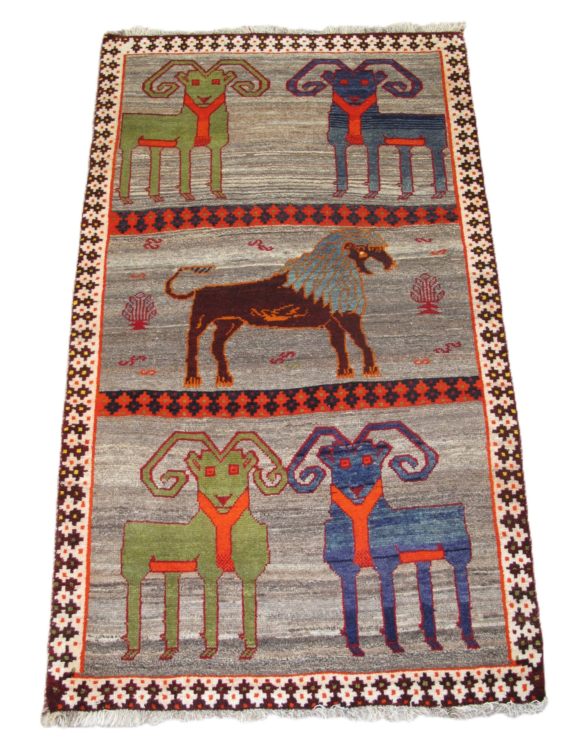 Rug with repeating ram figures in green, blue, and brown on a gray background, bordered in brown and white.