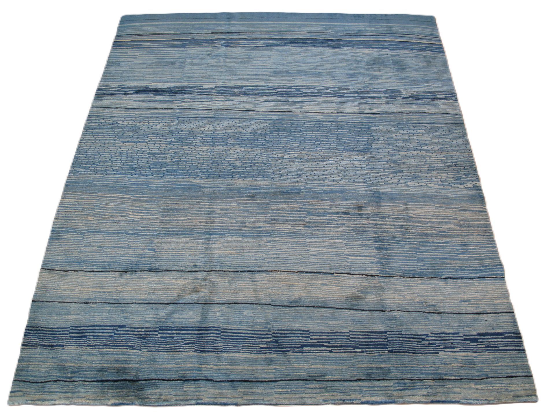 Blue and gray rectangular rug with horizontal textured pattern.