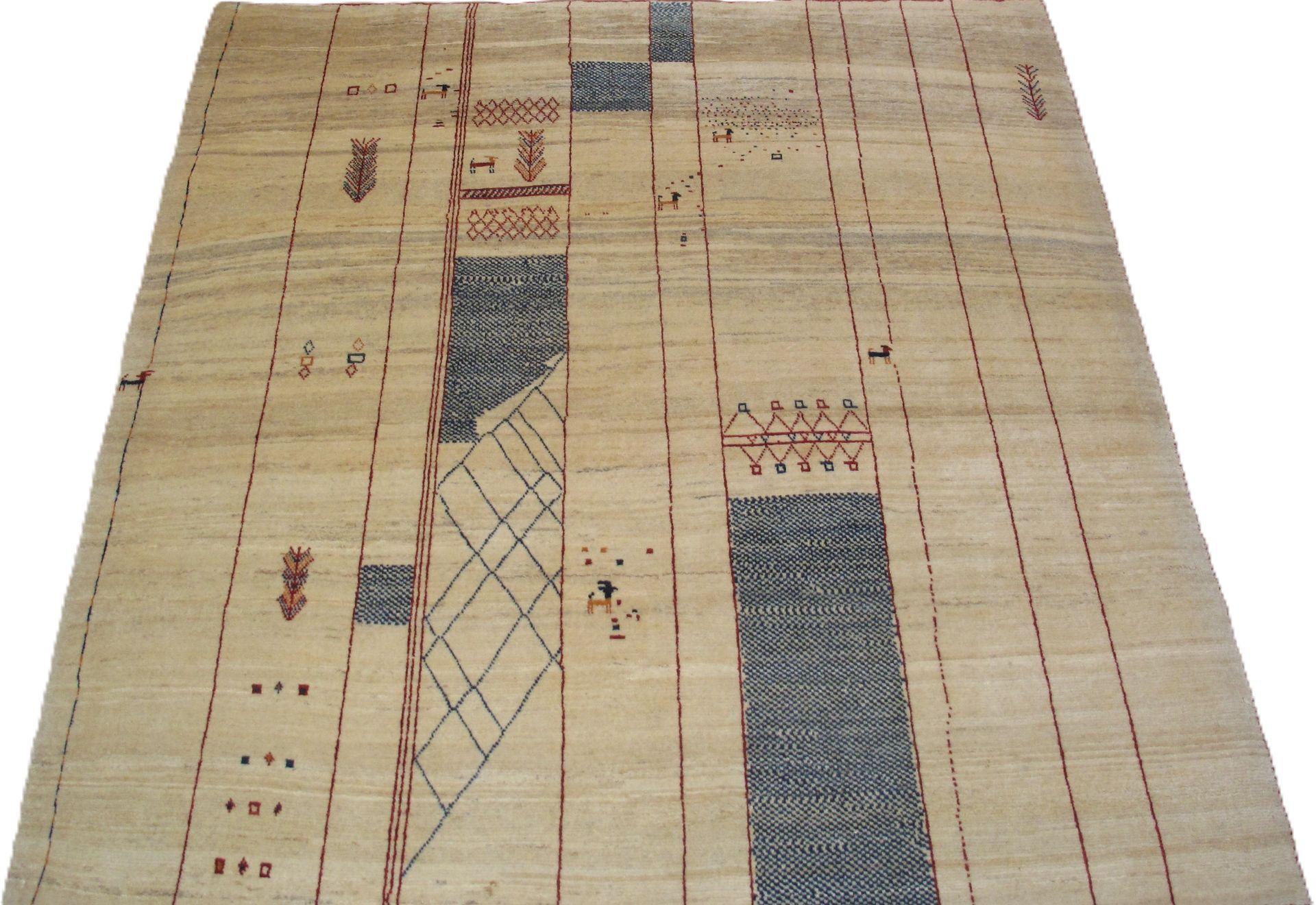Beige rug with geometric dark blue and red patterned designs.