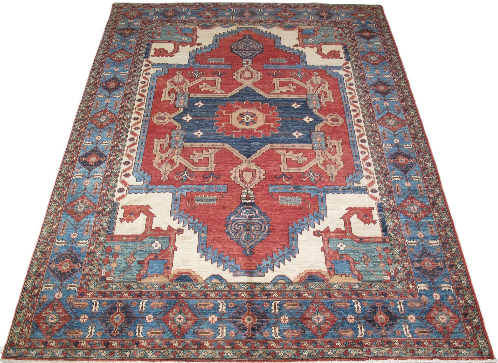Oriental rug with a blue and red central design, surrounded by a blue border.