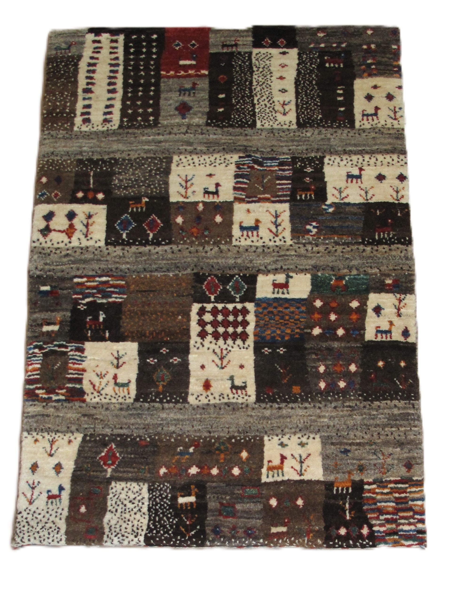 Patchwork-style woven rug with earthy brown, beige, black, and red geometric patterns