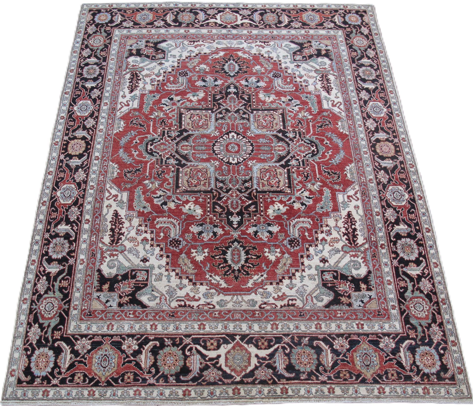 Red, black, and white Oriental rug with an intricate floral and geometric design.