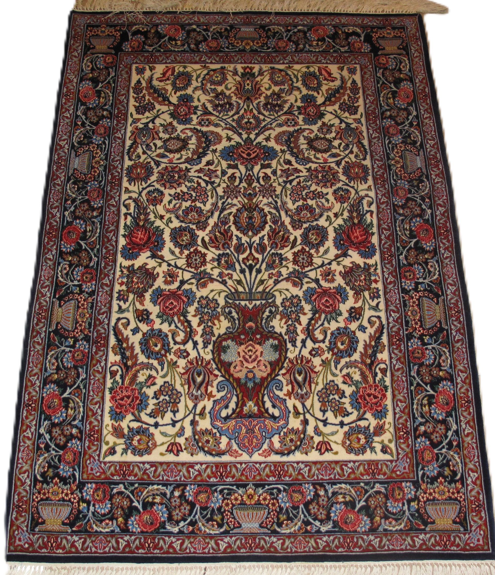 Oriental rug with floral and vase motif in cream, red, and blue with fringe trim.