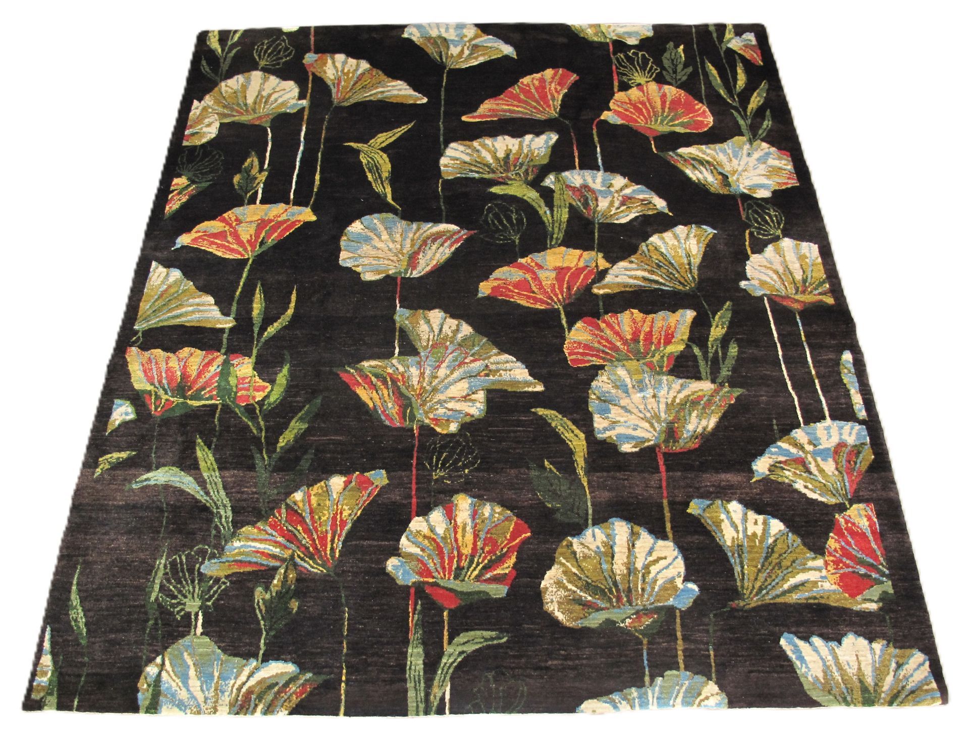 Floral patterned rug with orange, blue, and yellow flowers on a black background.