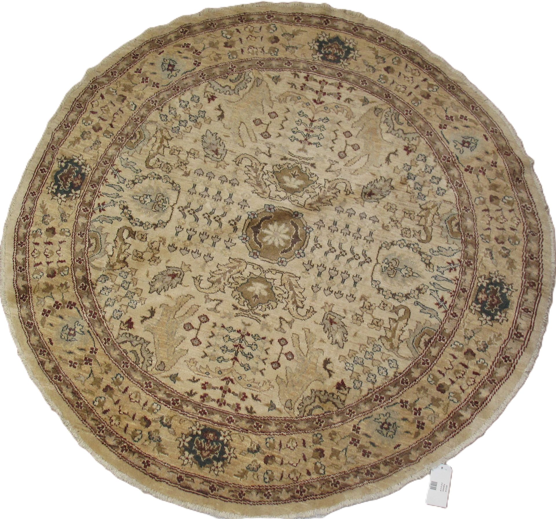 Round beige rug with detailed floral patterns, dark brown and blue accents.