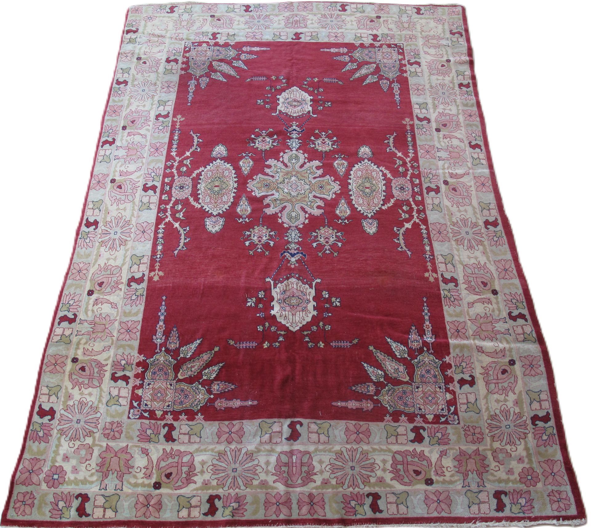 Red and beige patterned area rug with an ornate central medallion design