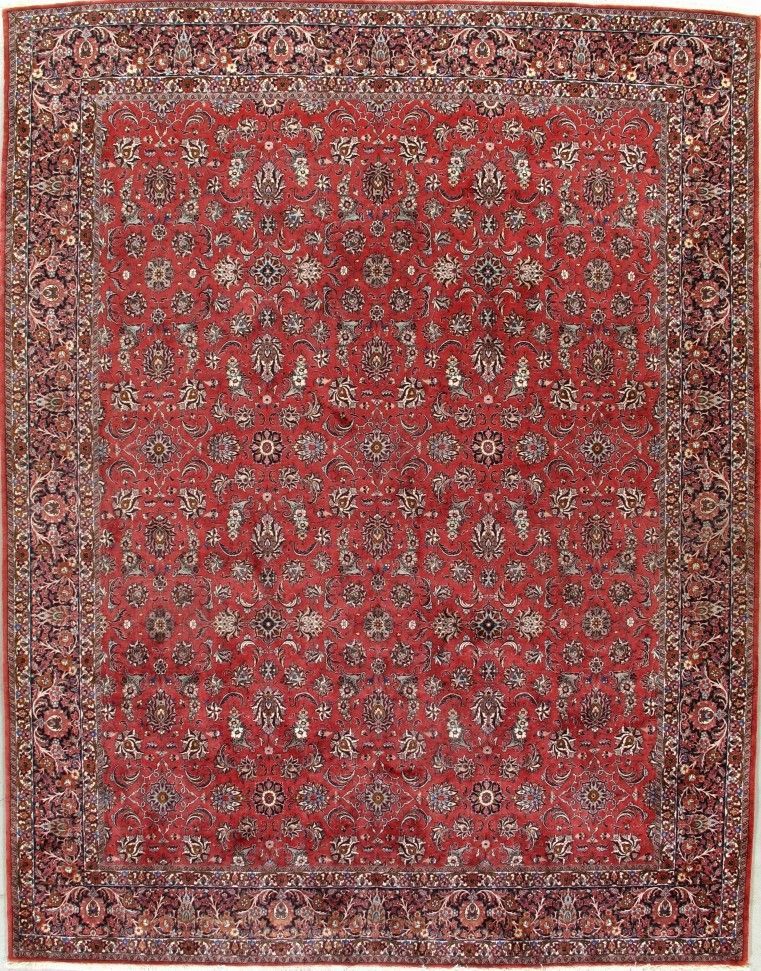 Red patterned Persian-style rug with a detailed border on a plain background