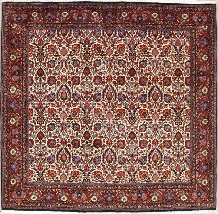 Square Persian rug with a cream background, red border, and floral patterns in red, purple, and brown.