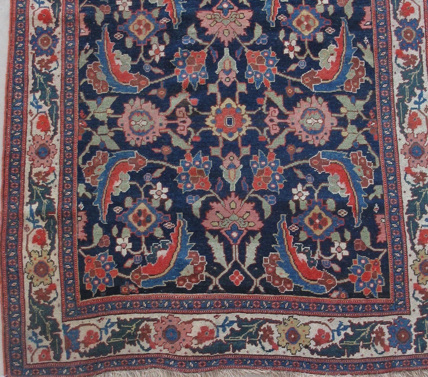 A close up of a rug with a floral pattern