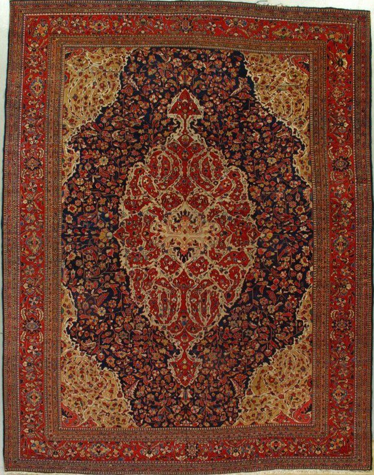 A rug with a floral pattern and a red border
