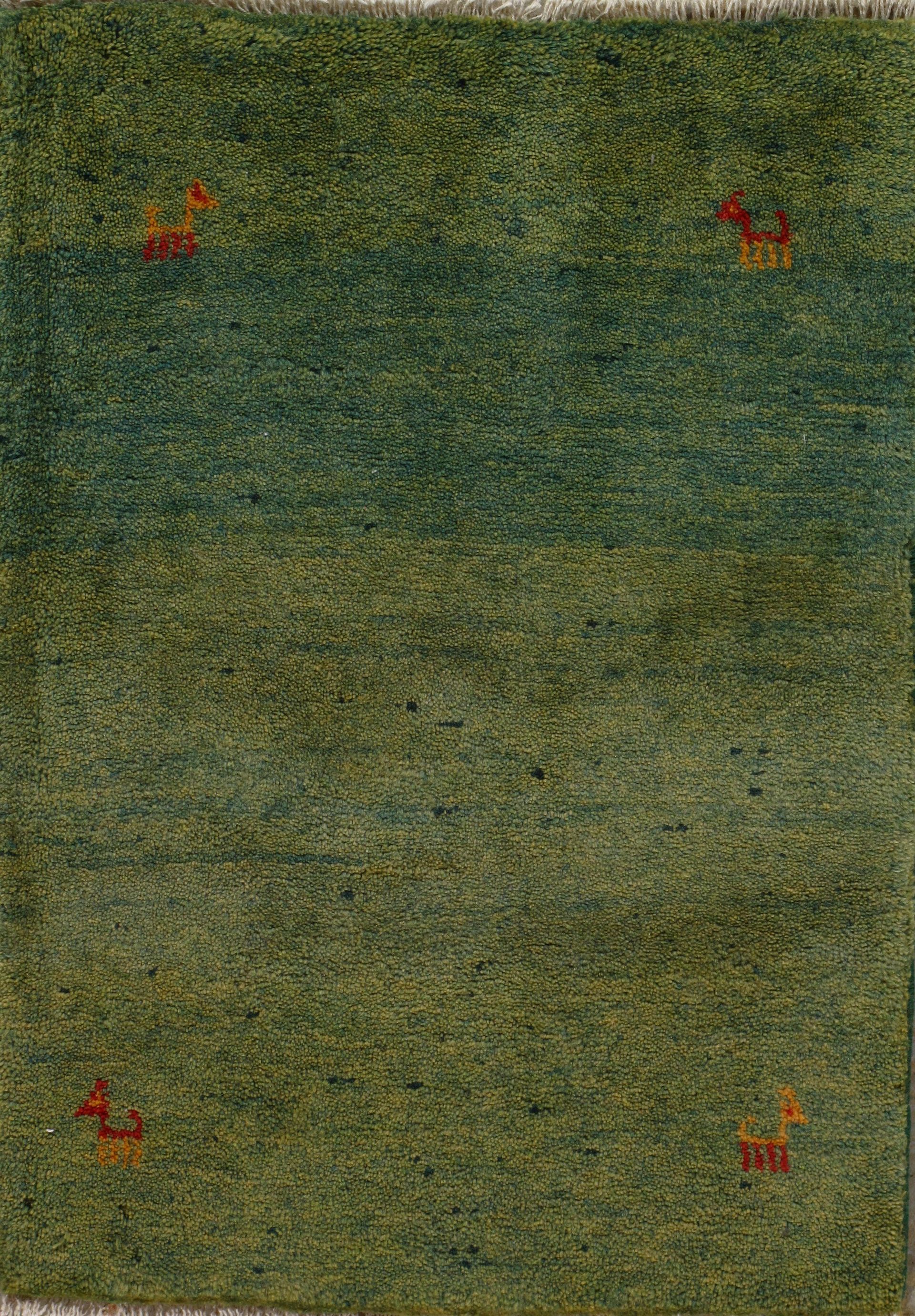 Green and blue textured rug with small orange animal figures and horizontal color bands.