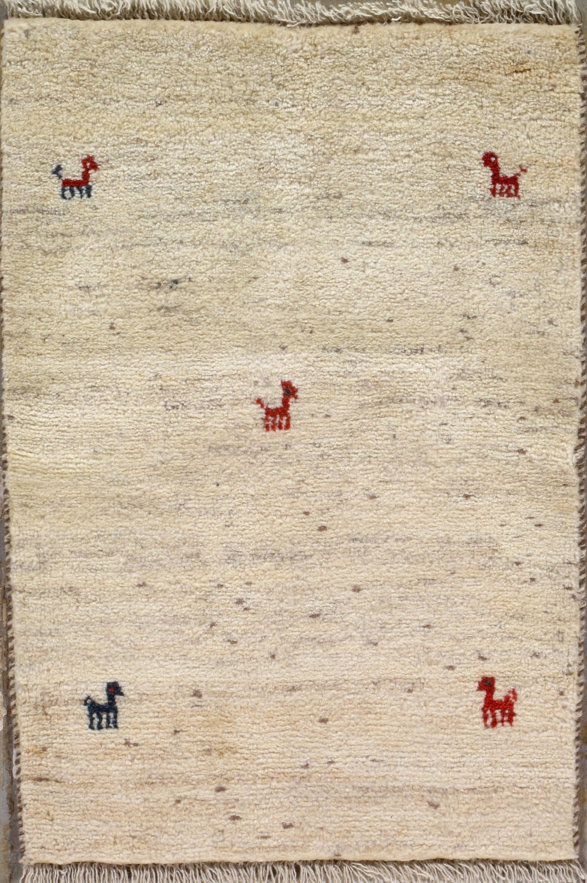 Beige rectangular rug with four small animal figures in red and blue.