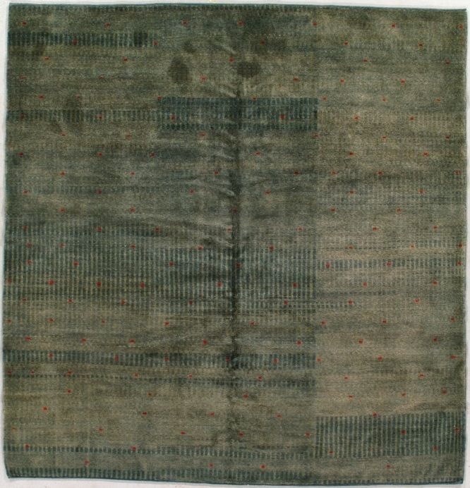 Green and gray square rug with geometric patterns.