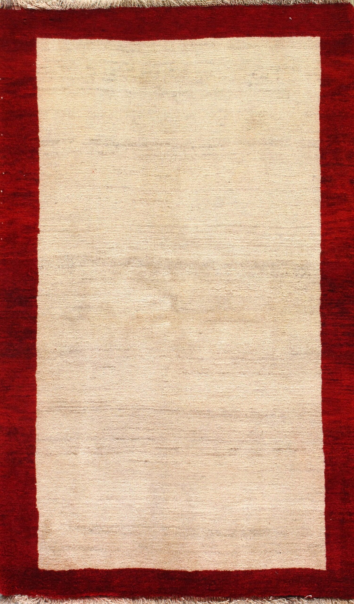 A rug with a red border and a white border