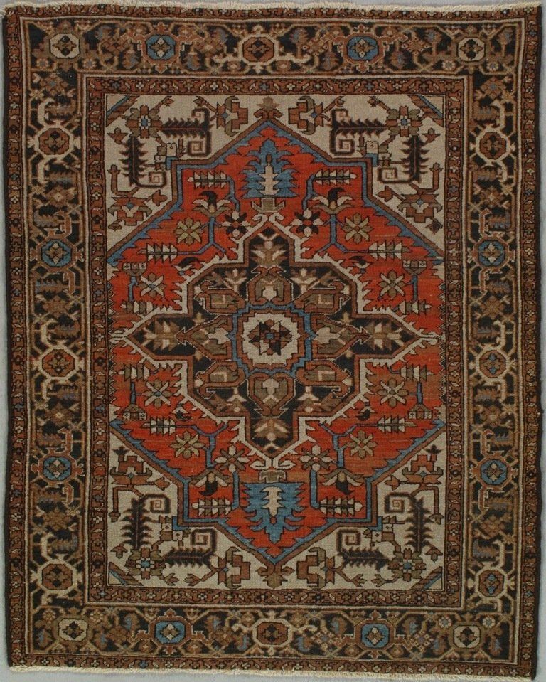 A rug with a geometric pattern is hanging on a wall