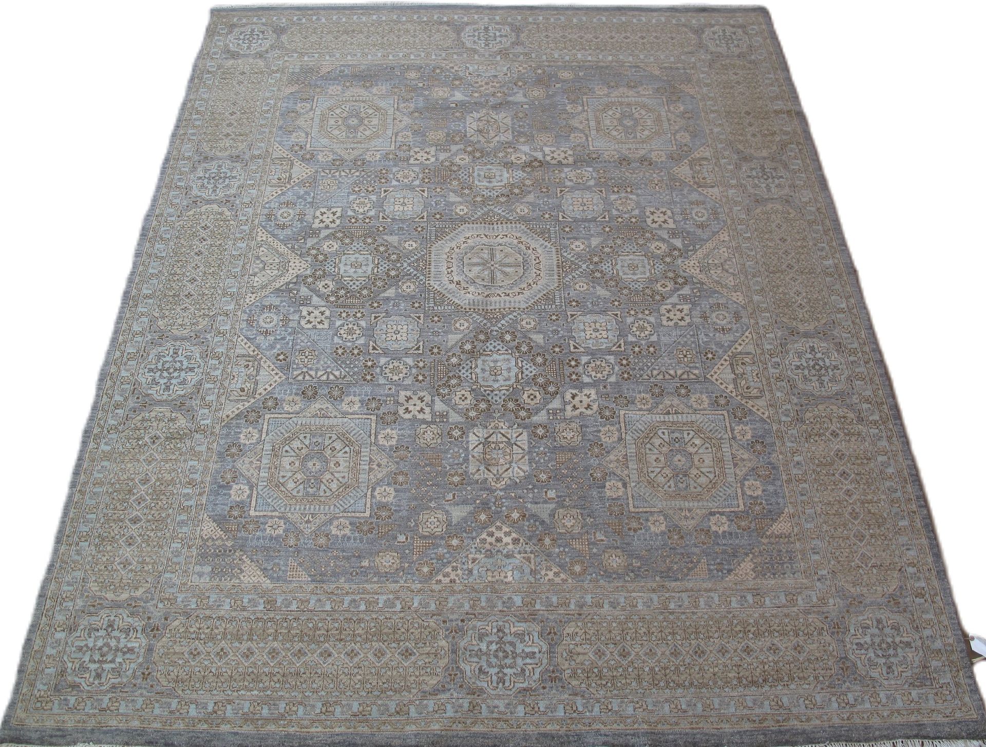 A rug with a pattern on it is on a white background
