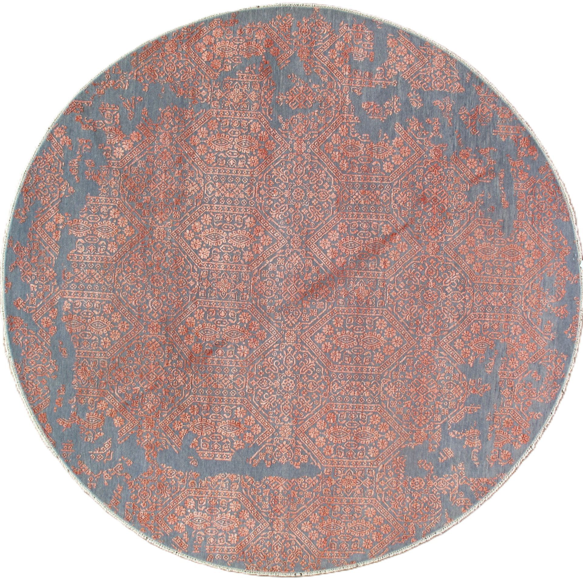 Round rug with a gray border and reddish-orange center, vintage style.