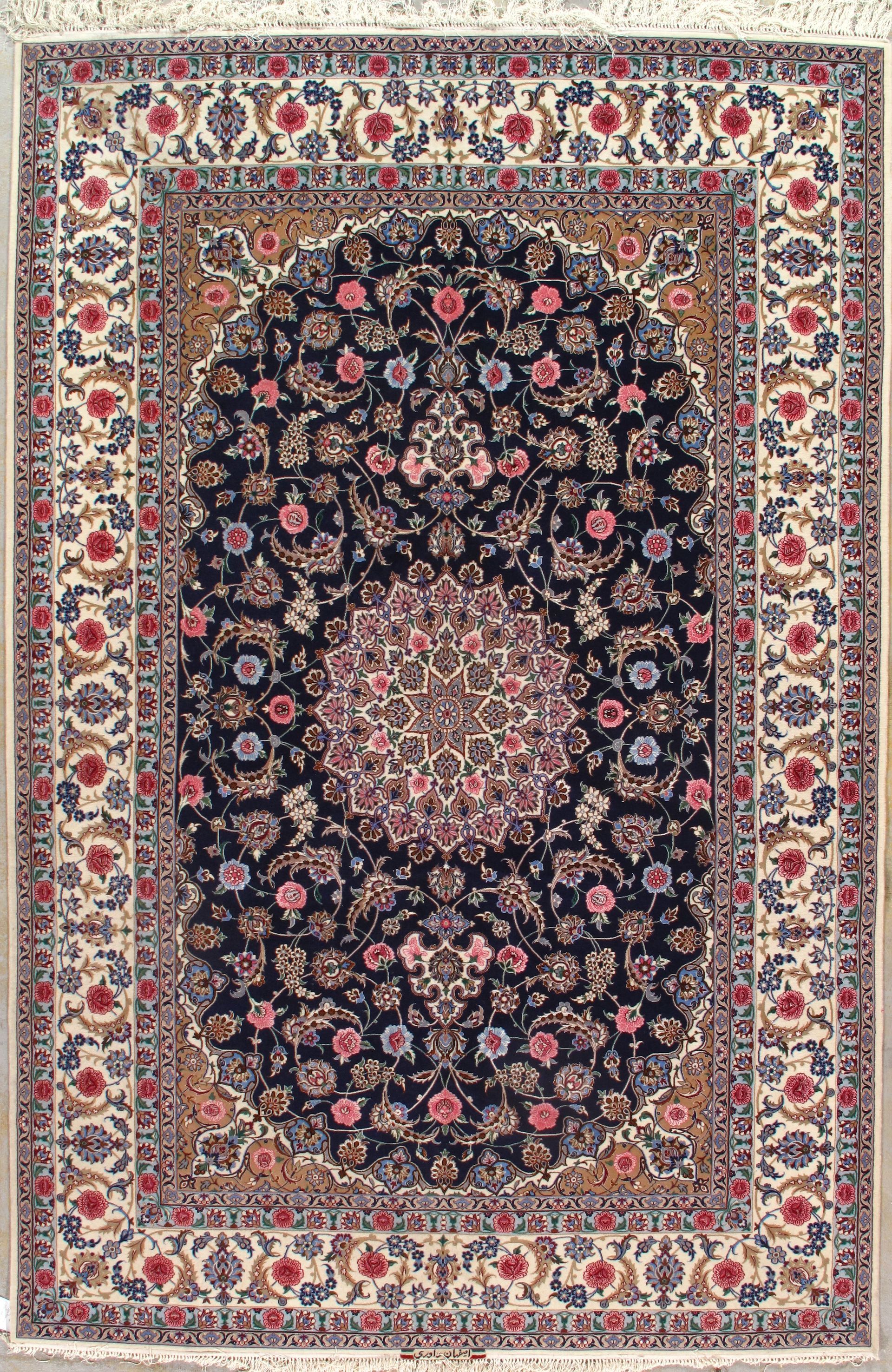 Persian rug with oval-shaped central design and floral borders; blue, cream, and red colors.
