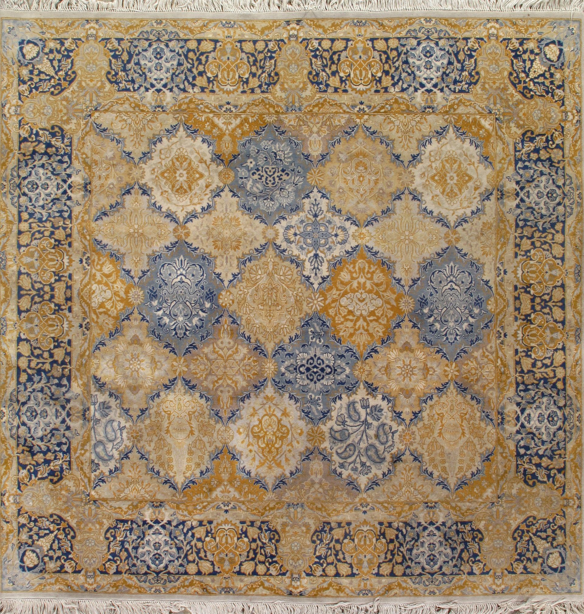 Square rug with ornate blue and yellow patterns.