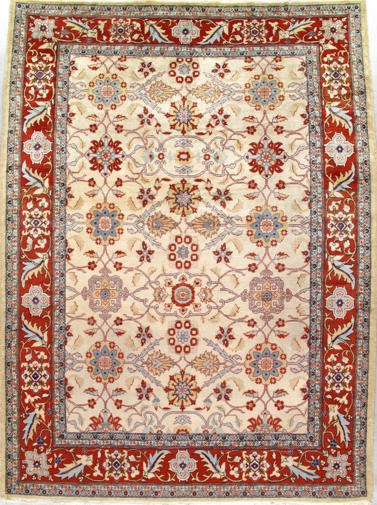Rectangular ivory and red Persian-style floral rug with ornate border and central medallion design