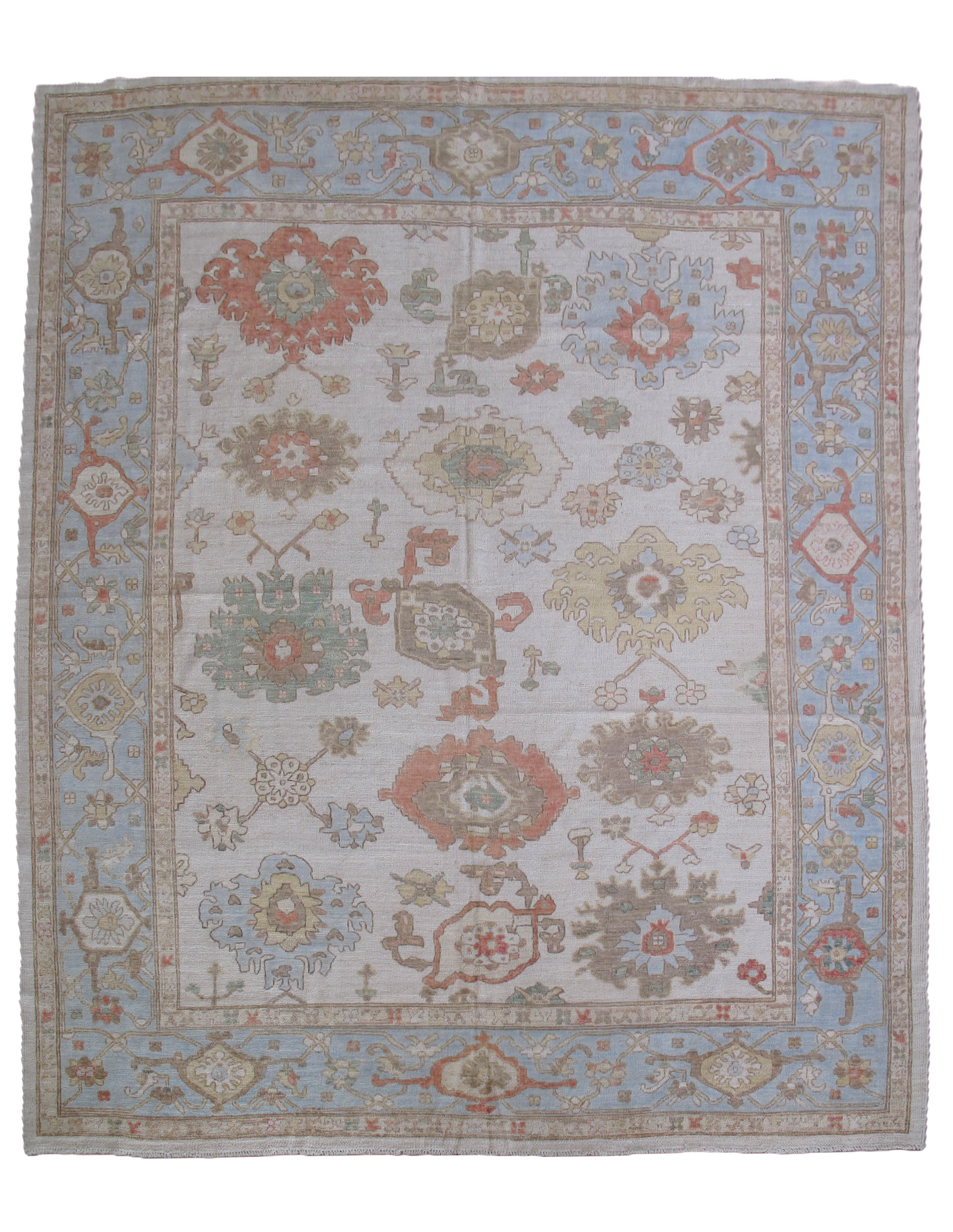 Blue and beige patterned rug with floral motifs.