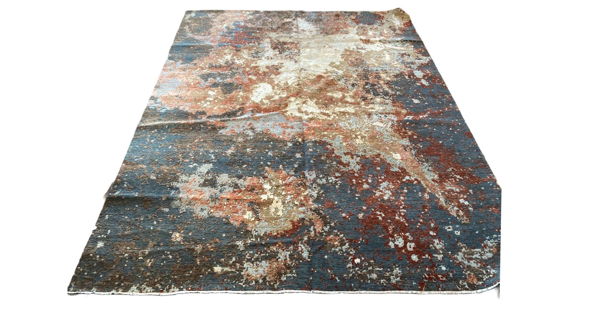 A close up of a rug with a painting on it.
