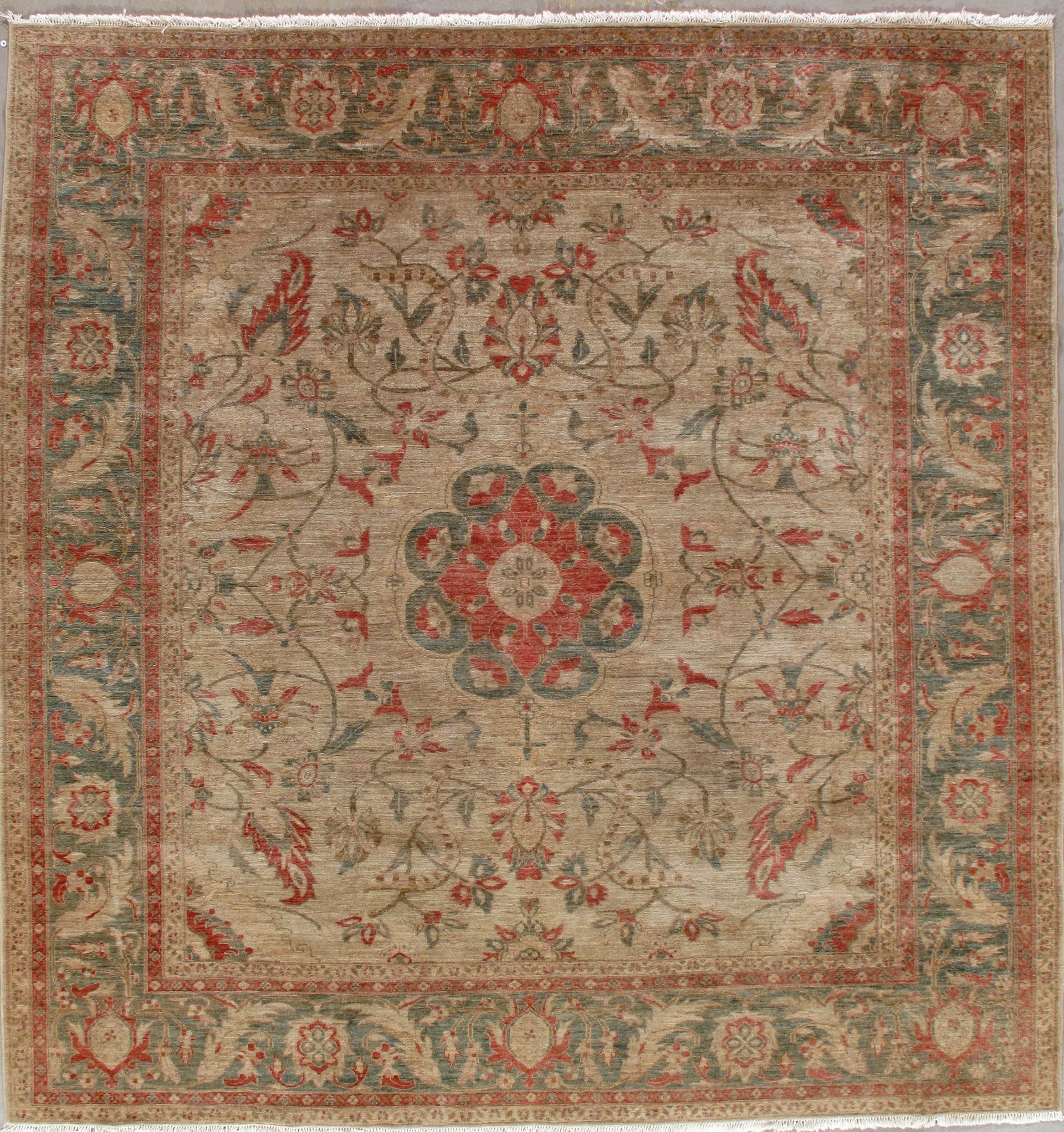 Beige and red oriental rug with floral medallion and ornate border pattern