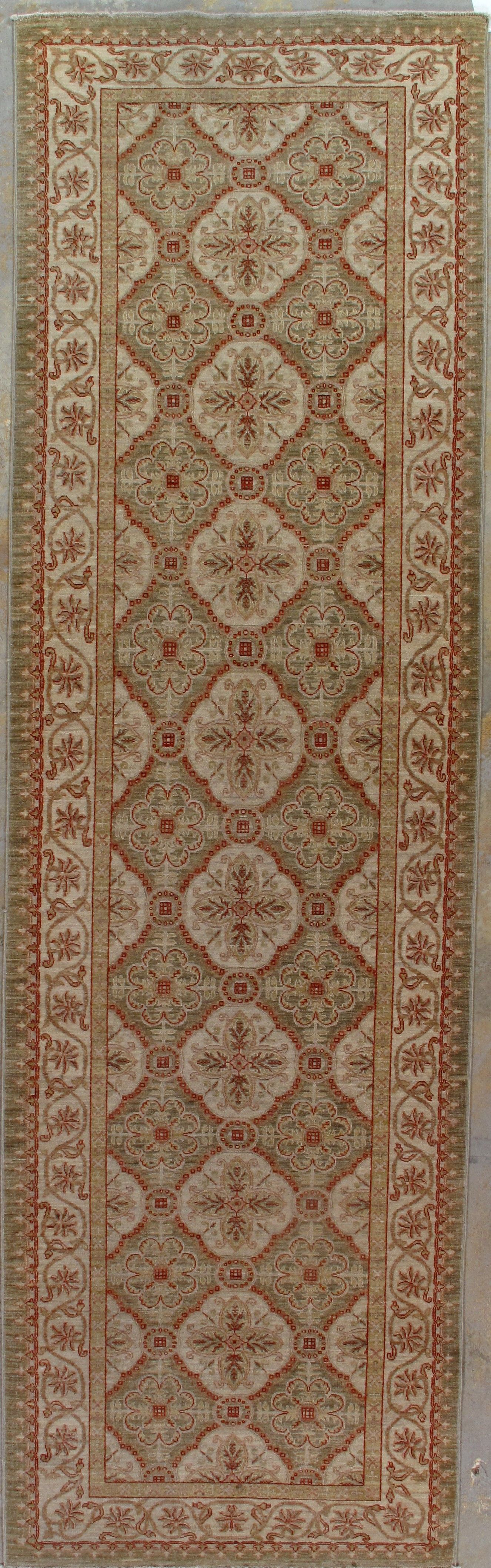 Long, narrow rug with a repeating diamond-shaped pattern in beige and rust colors.