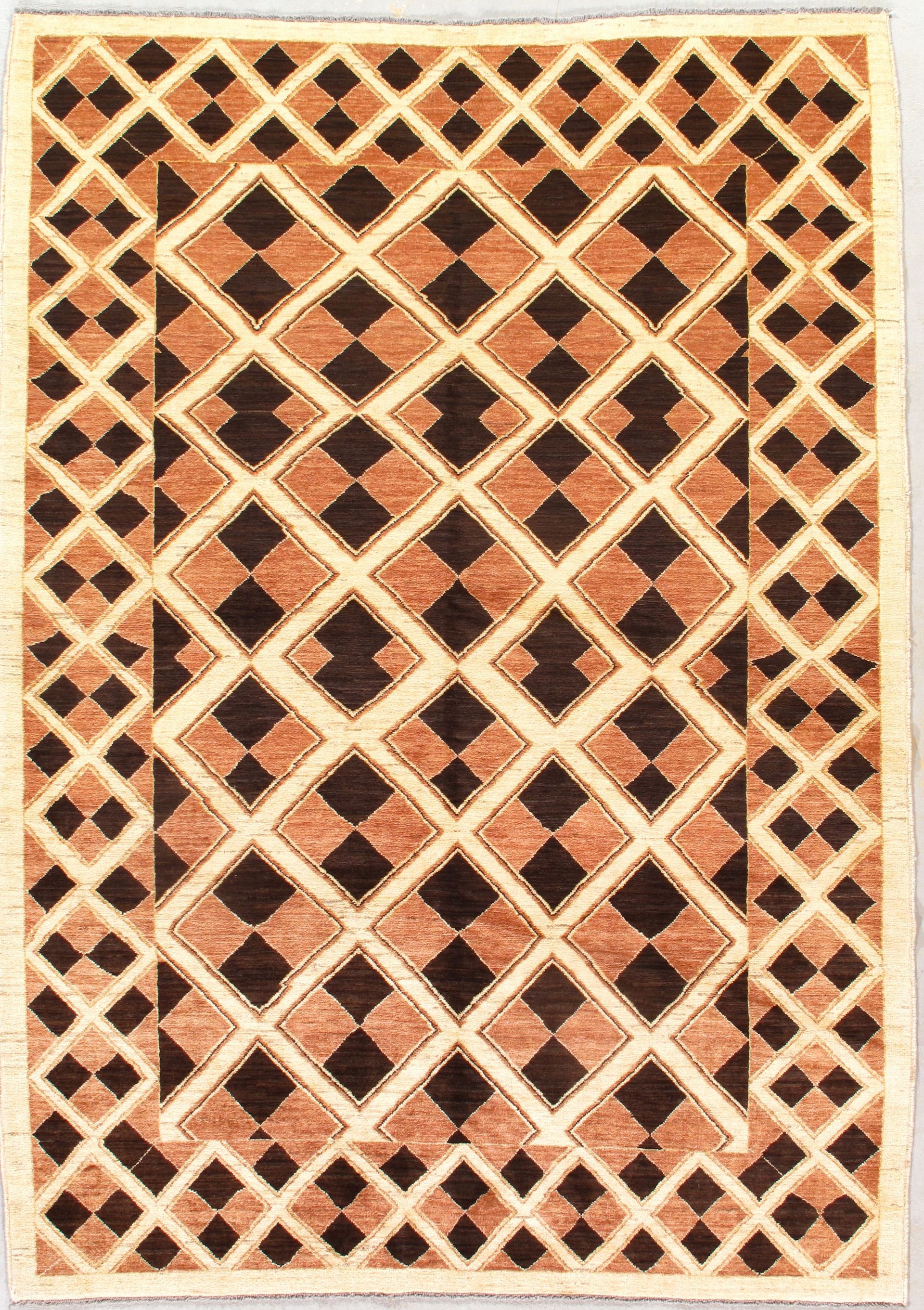 Geometric pattern rug with repeating brown and tan diamonds.