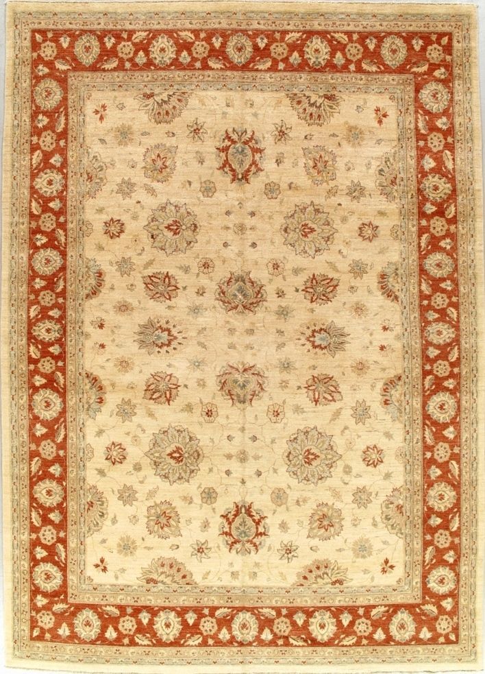 Cream floral-patterned rug with a red border and central medallion motifs