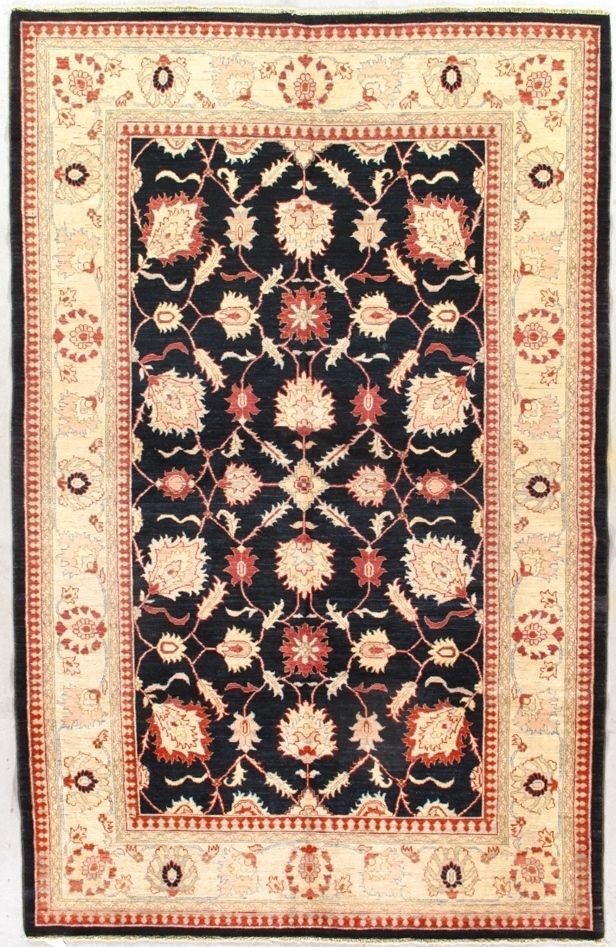 Black and cream oriental rug with floral and geometric patterns.