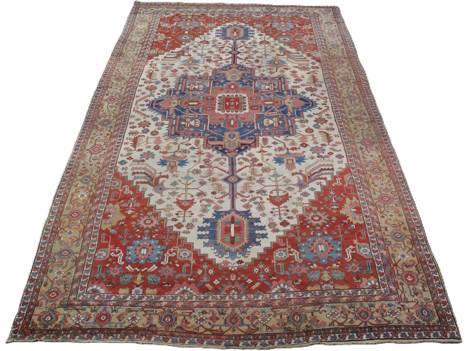 antique Persian Serapi rug with central medallion in a red and ivory palette, 12' x 20'9