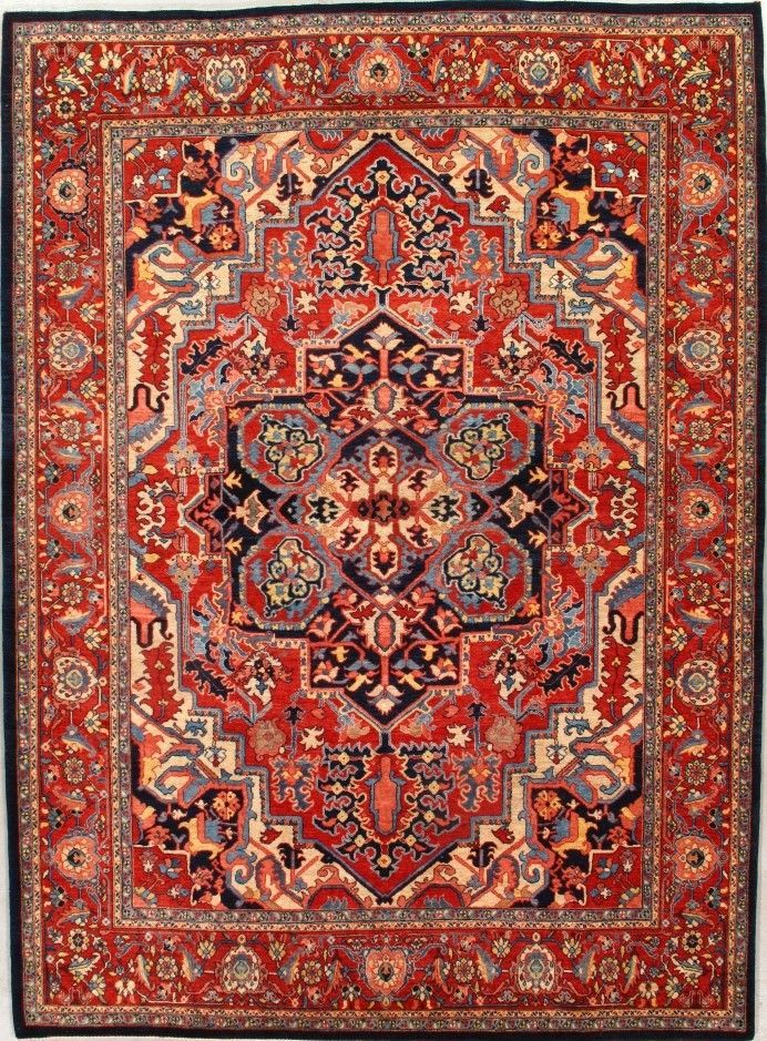 Red and navy oriental rug with intricate floral and geometric patterns.