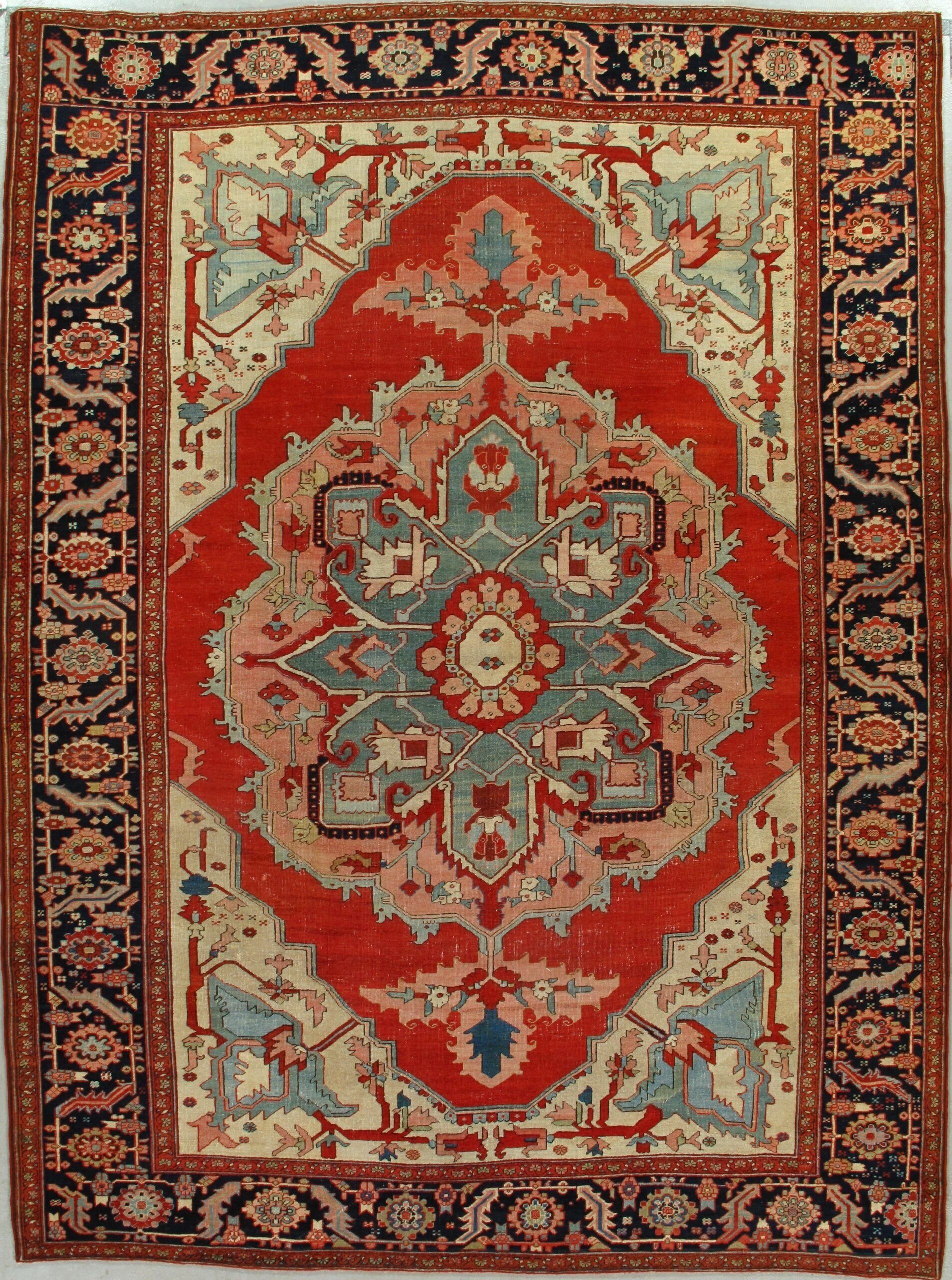 A red and white rug with a floral pattern on it