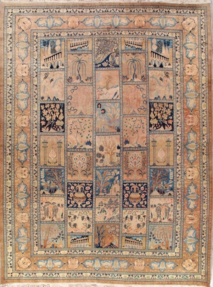 Antique rug with a grid of illustrated squares in blue and beige.