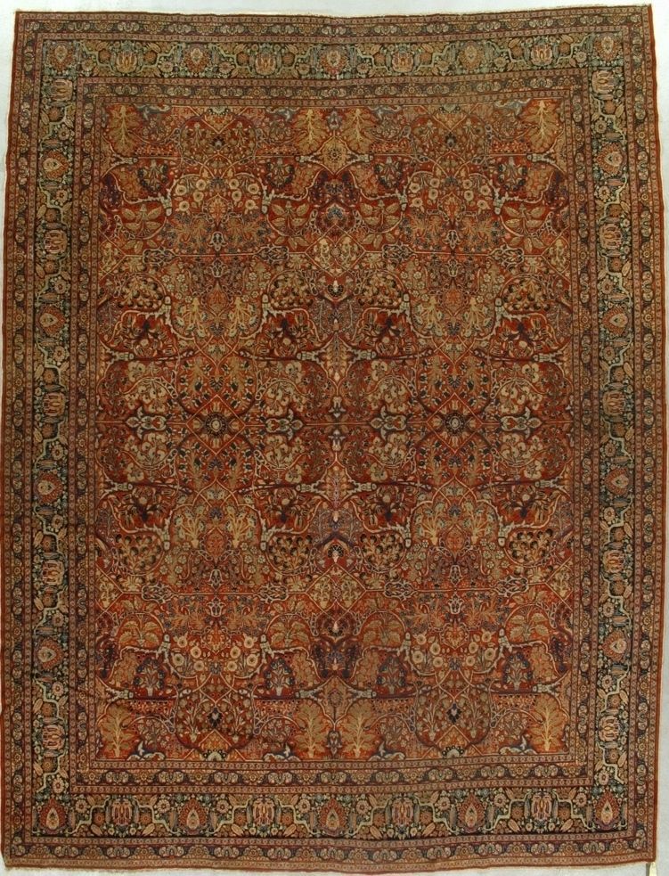 Oriental rug with ornate floral design, primarily red and brown with dark border.