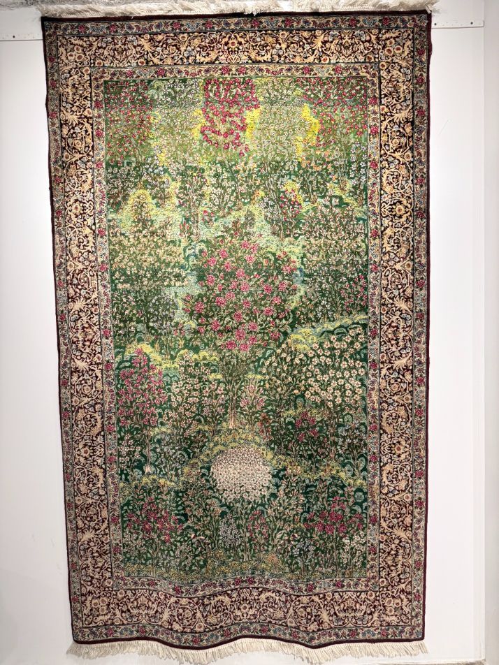 A Millefiore Persian Kerman rug on the screen showing the same colors of this beautiful MFA poppies painting.