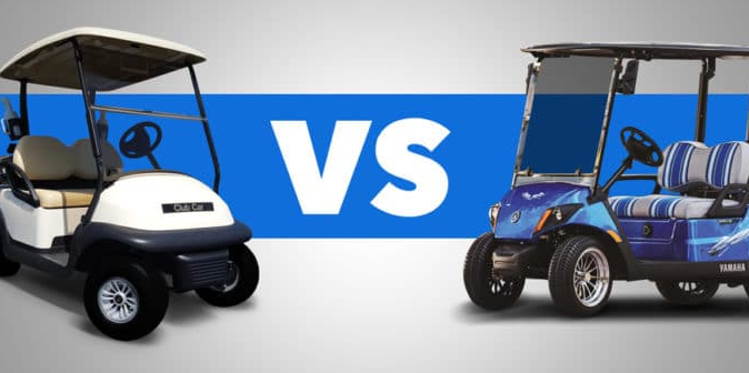 A white golf cart is next to a blue golf cart
