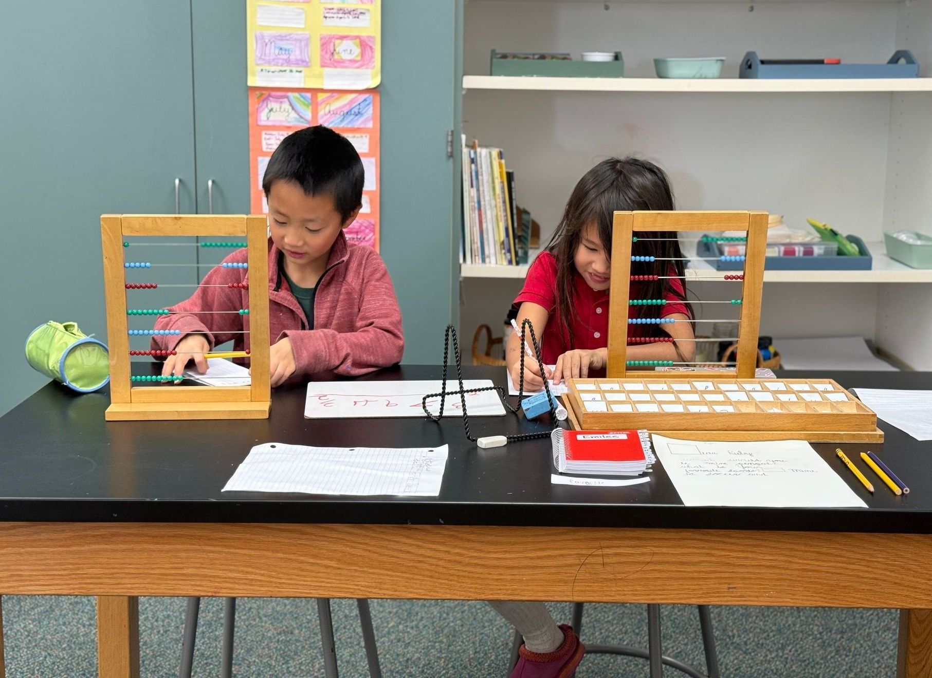 Montessori children working with abaci.